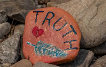 Truth painted on orange rock